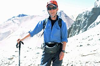 05 Jerome Ryan Put On His Helmet In A Rockfall Area In Warm 15C Weather On The Climb From Plaza Argentina Base Camp To Camp 1.jpg